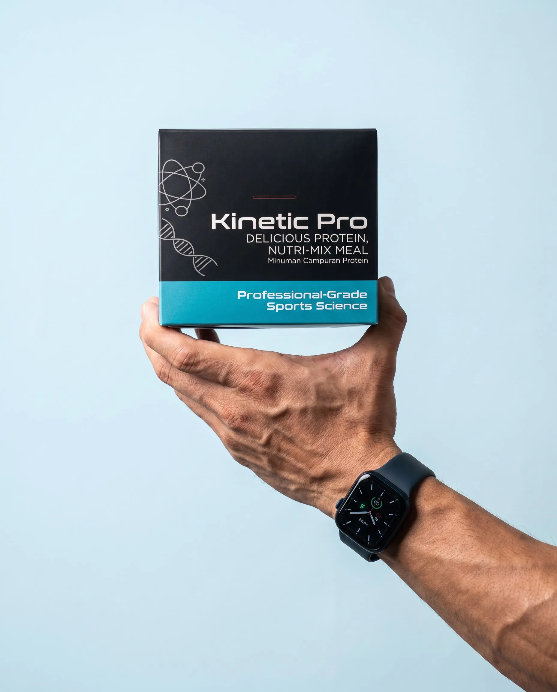 A hand holding the Kinetic Pro box